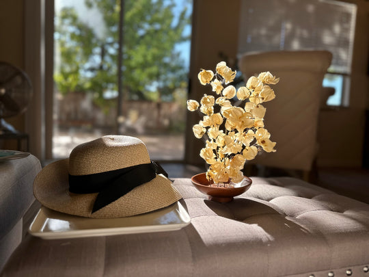 Ivory dried flower arrangement in wood bowl