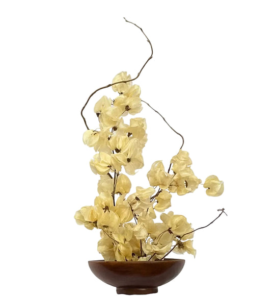 Ivory dried flower arrangement in wood bowl