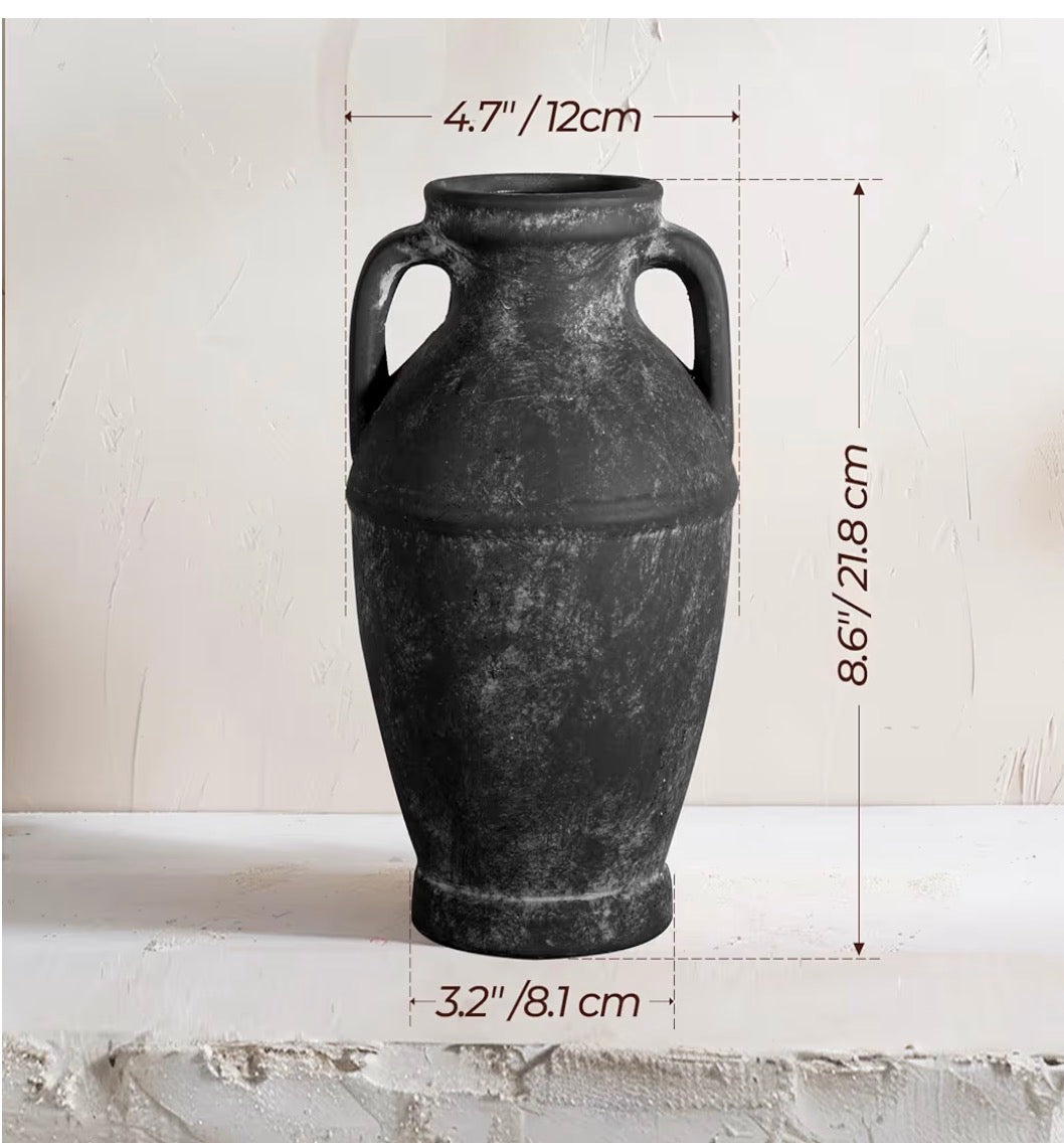 Black ceramic vase with dimensions on a light gray background