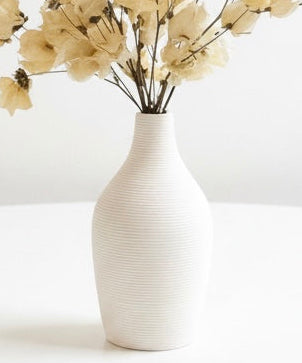 Ivory dried flower arrangement in vase