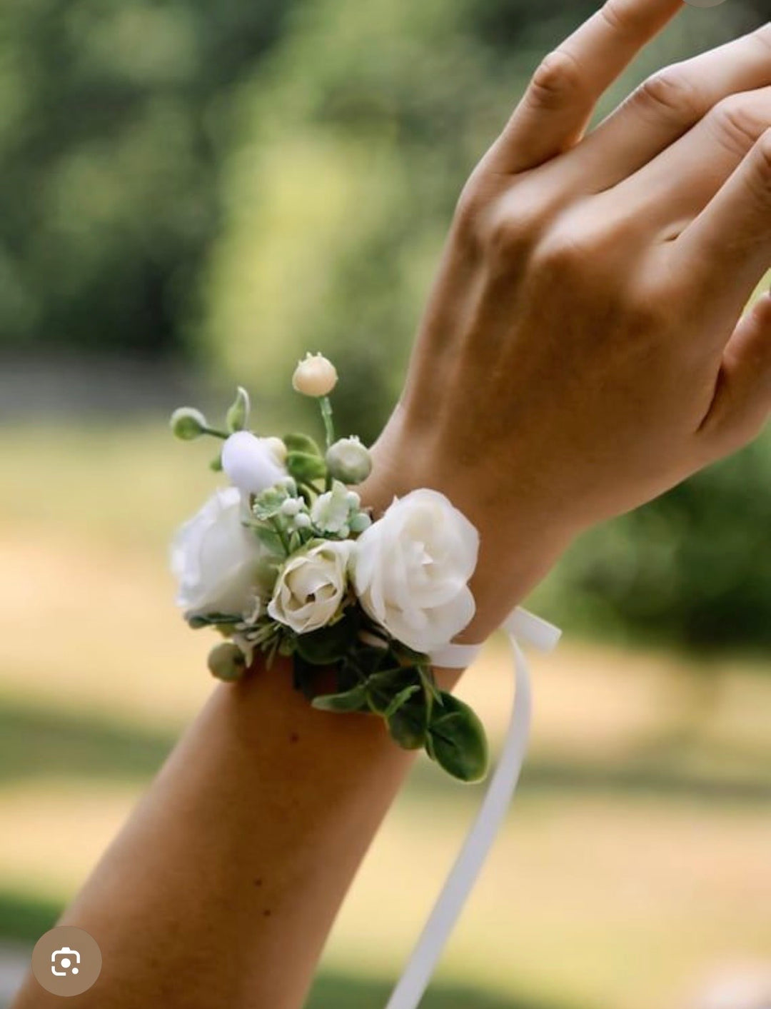 White & pastel wrist corsage