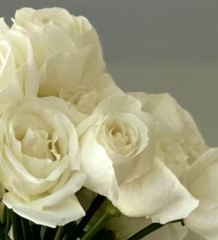 White roses in clear glass