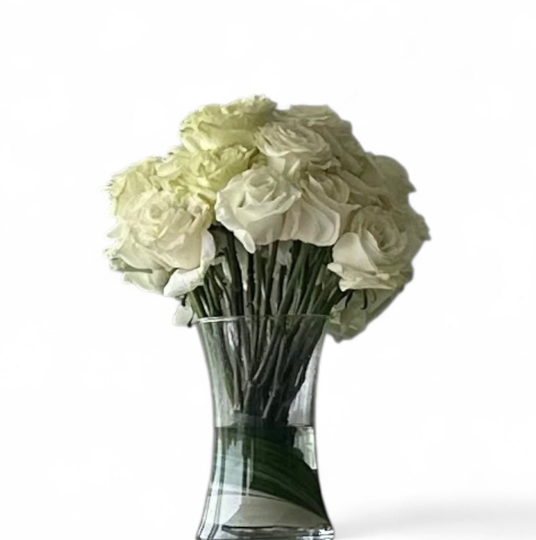 White roses in clear glass