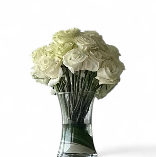 White roses in clear glass
