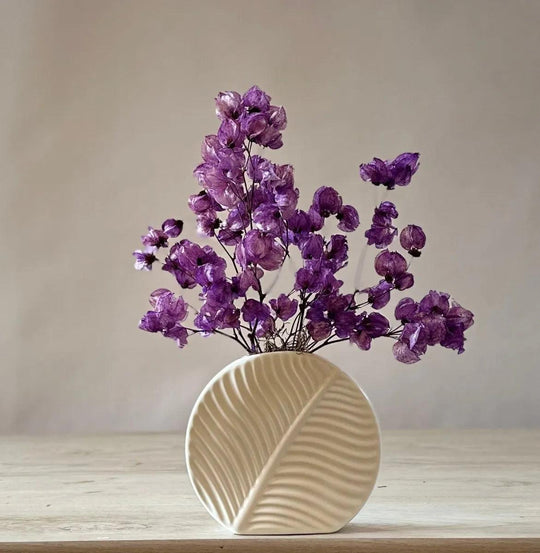 Aubergine purple dried flower arrangement in ceramic vase